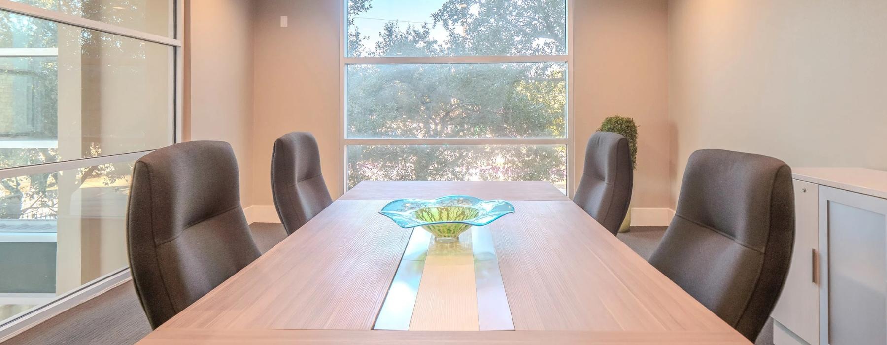 a conference room with a table and chairs