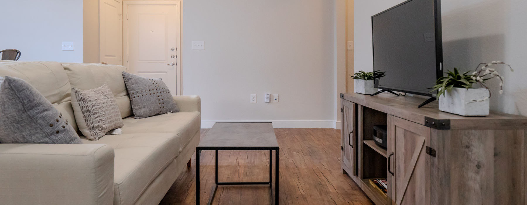 living room with a couch and television