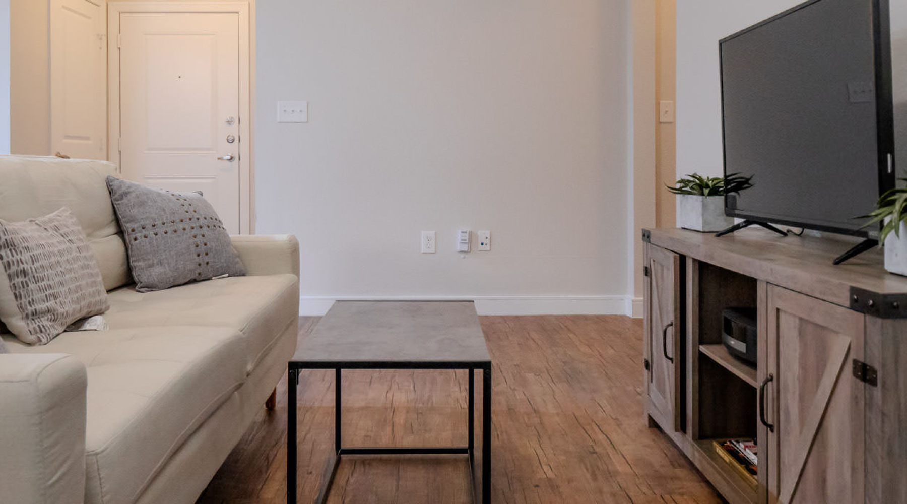living room with a couch and television
