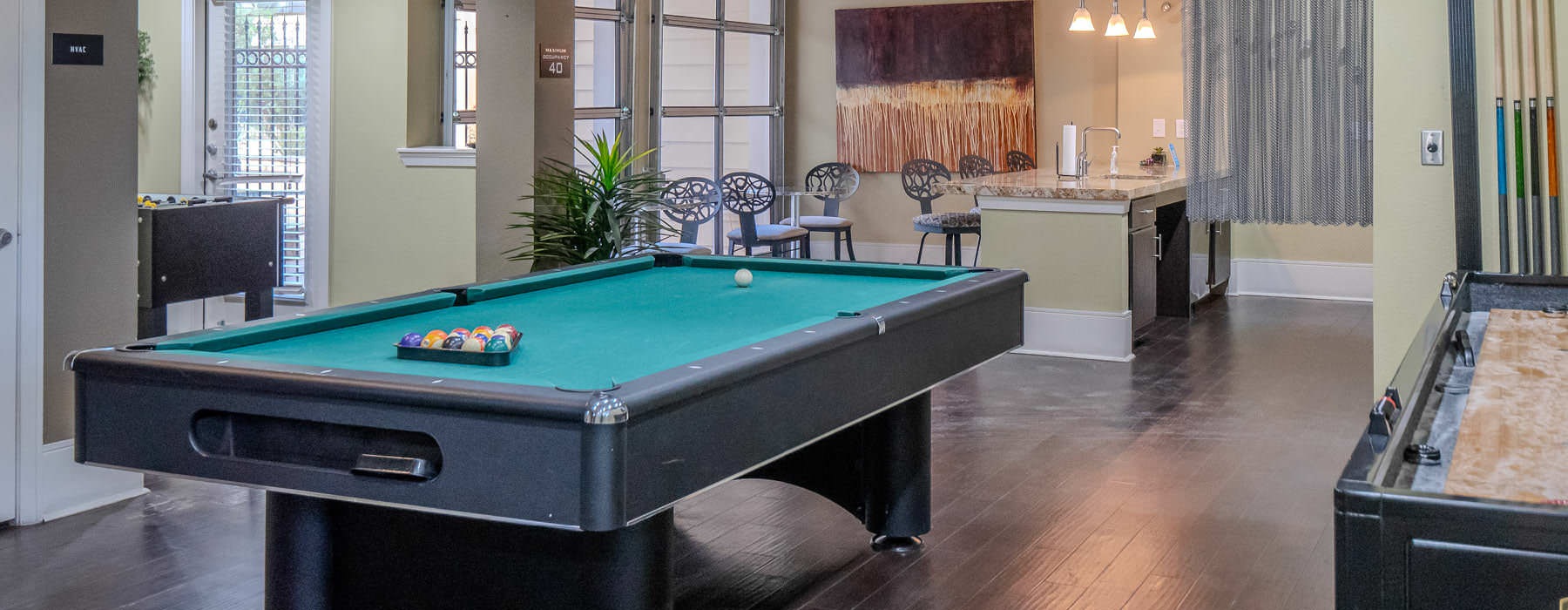 a pool table in a well-lit room